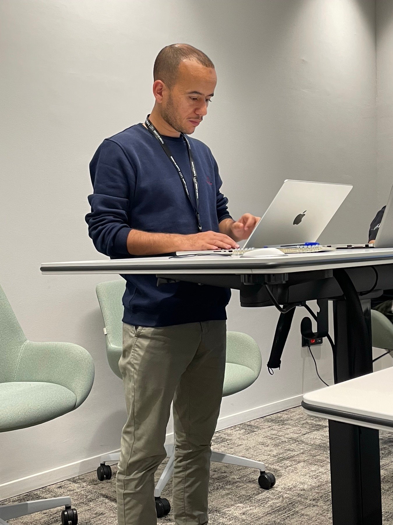 Mohamed Tawil working at a standing desk